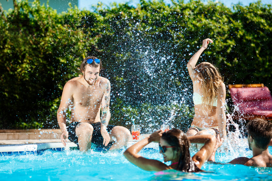 young-cheerful-friends-smiling-laughing-relaxing-swimming-in-pool (1)